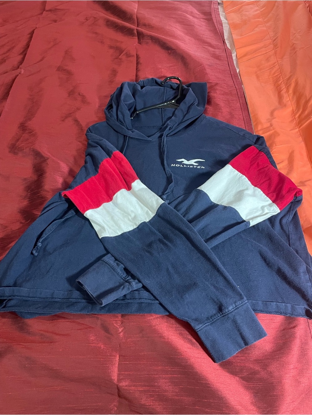 Hollister Navy Hoodie with Red and White Sleeve Stripes